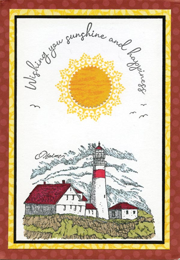 A house and lighthouse under a large sun with "Wishing you sunshine and happiness" written in cursive over the sun